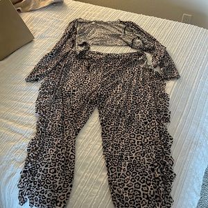 Cheetah swimsuit, cover-up pants with ruffles and matching top ties in middle